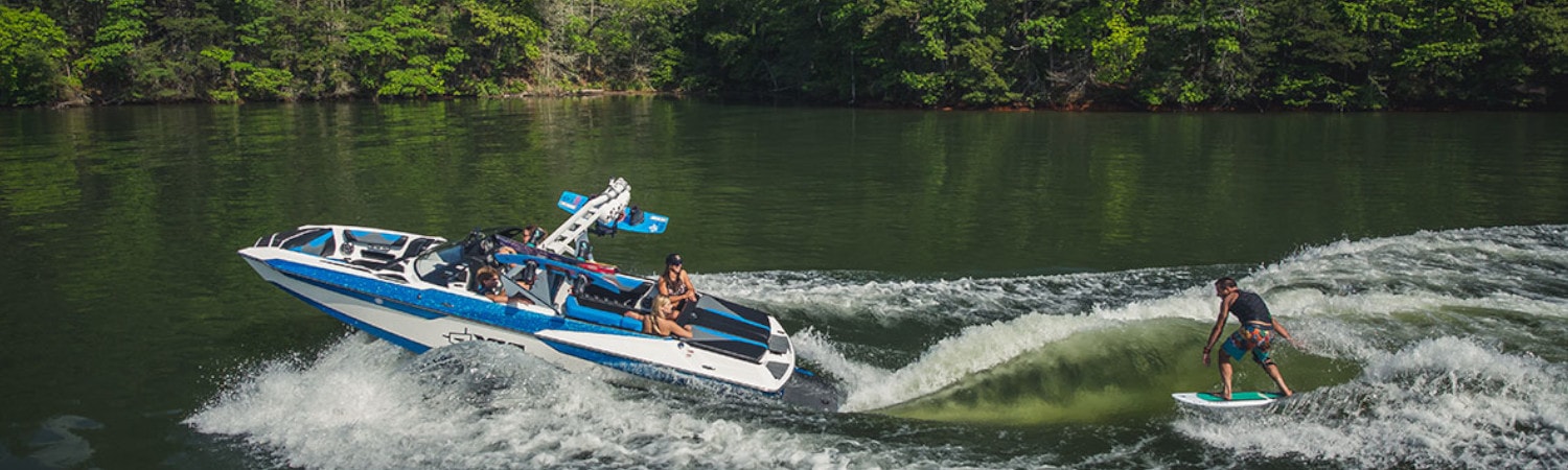 2019 Axis Wake A22(3) boat towing a wakeboarder